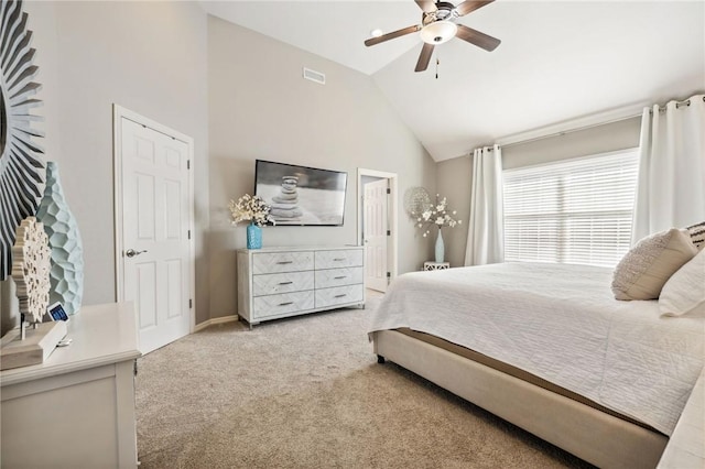 bedroom featuring vaulted ceiling, light carpet, and ceiling fan