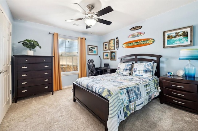 carpeted bedroom with ceiling fan