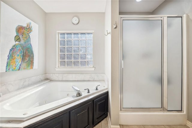 bathroom with shower with separate bathtub