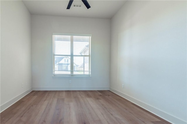1200 Carrara St, Tontitown, AR 72762 - empty room featuring light wood-type flooring, baseboards, and ceiling fan