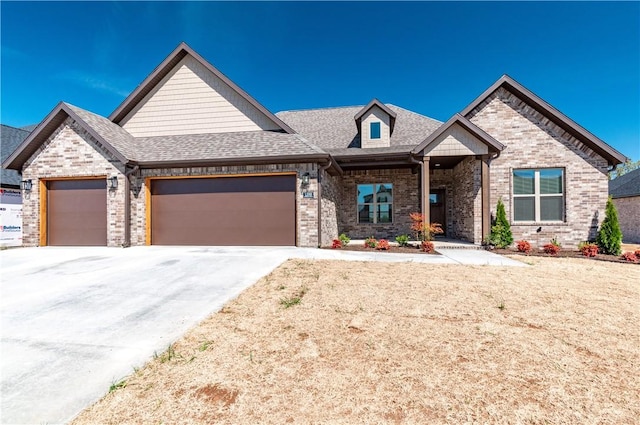 1200 Carrara St, Tontitown, AR 72762 - view of front of home featuring a garage, brick siding, concrete driveway, and roof with shingles