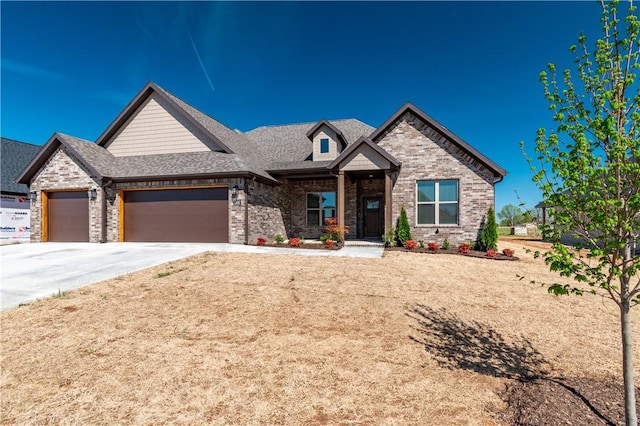 1200 Carrara St, Tontitown, AR 72762 - view of front of home featuring an attached garage, driveway, and brick siding