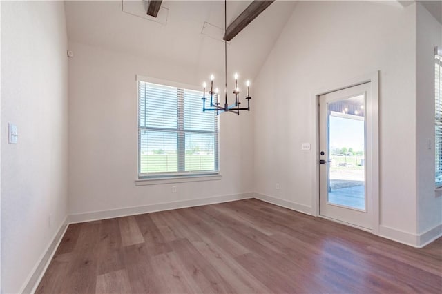 1200 Carrara St, Tontitown, AR 72762 - unfurnished dining area featuring wood finished floors, a chandelier, baseboards, and high vaulted ceiling