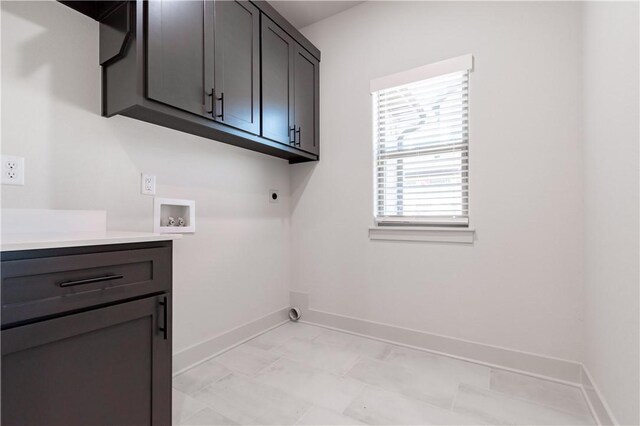1200 Carrara St, Tontitown, AR 72762 - laundry area with electric dryer hookup, cabinet space, hookup for a washing machine, and baseboards