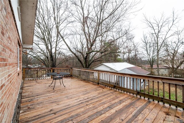 10624 W High Meadows Dr, Rogers, AR 72756 - wooden deck with outdoor dining space