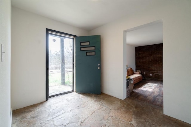 interior space with stone finish flooring and plenty of natural light