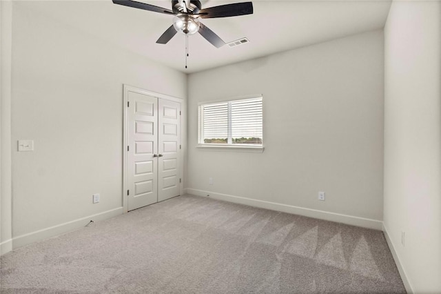 1808 Charles St, Pea Ridge, AR 72751 - unfurnished bedroom with carpet flooring, ceiling fan, and a closet