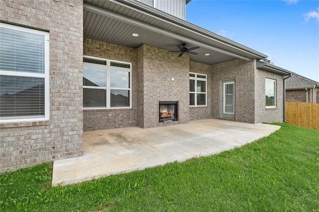 1808 Charles St, Pea Ridge, AR 72751 - view of patio with an outdoor brick fireplace and a ceiling fan