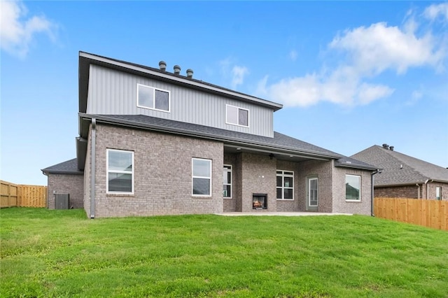1808 Charles St, Pea Ridge, AR 72751 - rear view of property with a fenced backyard, a patio, brick siding, and ceiling fan