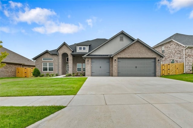 1808 Charles St, Pea Ridge, AR 72751 - view of front of home with an attached garage, driveway, brick siding, and a gate