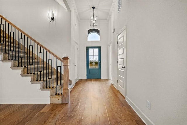 1808 Charles St, Pea Ridge, AR 72751 - foyer with stairway, wood finished floors, ornamental molding, and a high ceiling