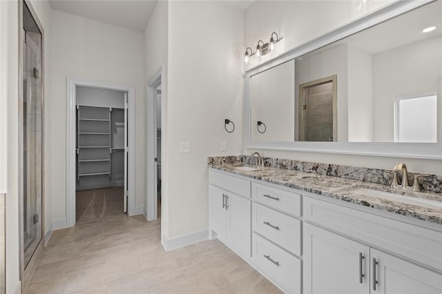1808 Charles St, Pea Ridge, AR 72751 - full bath with double vanity, a stall shower, and a walk in closet