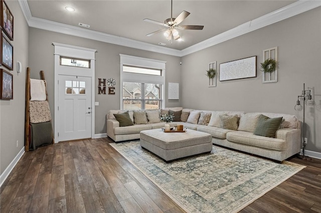 living room with ornamental molding, dark hardwood / wood-style floors, and ceiling fan