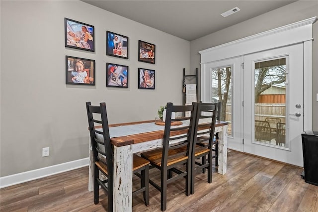 dining room featuring hardwood / wood-style flooring