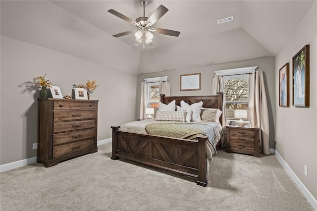 carpeted bedroom featuring vaulted ceiling and ceiling fan