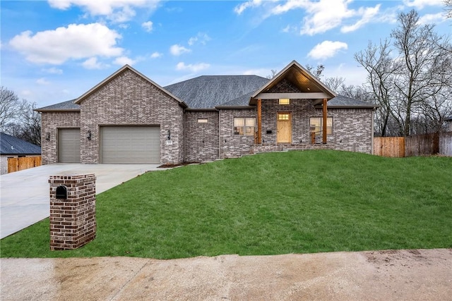 view of front of property featuring a garage and a front yard