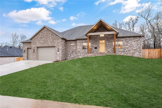 view of front of home with a garage and a front lawn