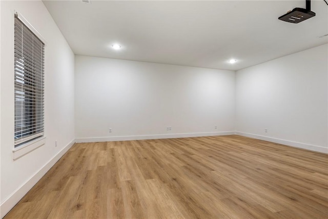 spare room with light hardwood / wood-style floors