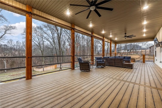 unfurnished sunroom with ceiling fan and wooden ceiling