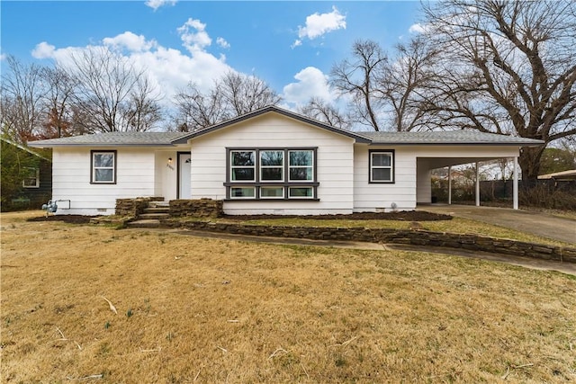 ranch-style house with a front lawn and a carport