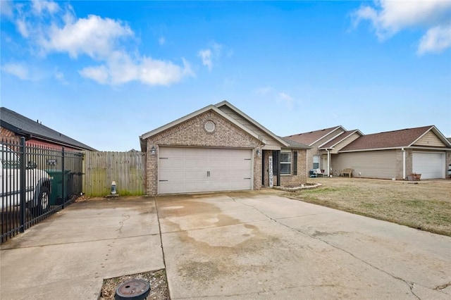 ranch-style home featuring a garage and a front yard