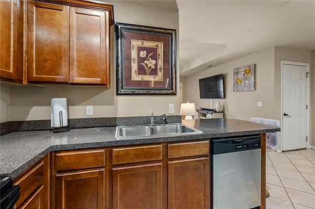 kitchen featuring light tile patterned flooring, dishwasher, sink, and stove