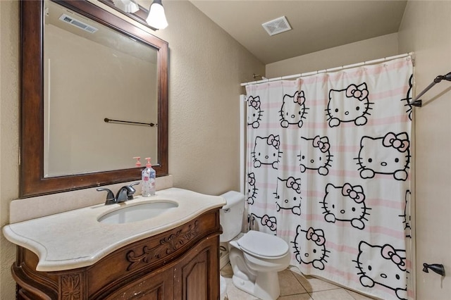 bathroom featuring tile patterned flooring, vanity, curtained shower, and toilet