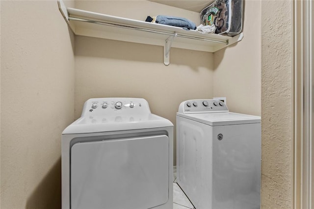 washroom with independent washer and dryer