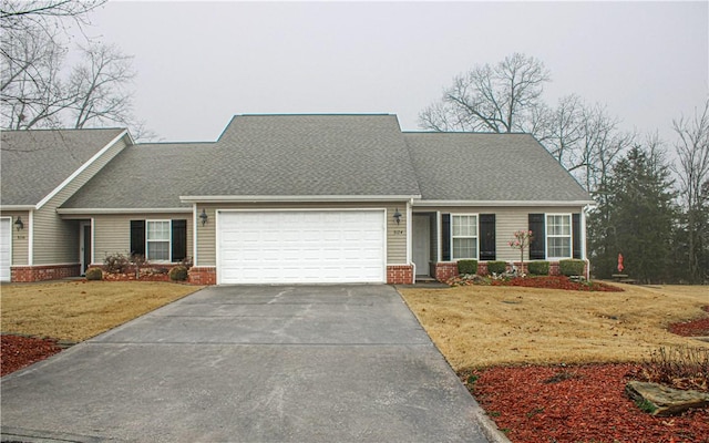 view of front facade with a garage and a front yard