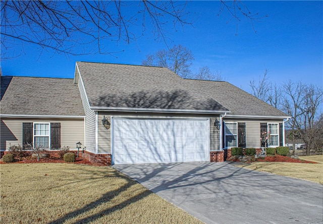 view of front of property featuring an attached garage, roof with shingles, a front lawn, and brick siding