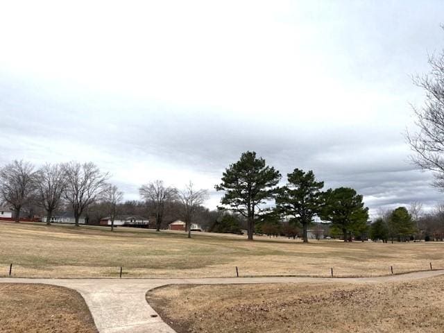 view of home's community featuring a lawn