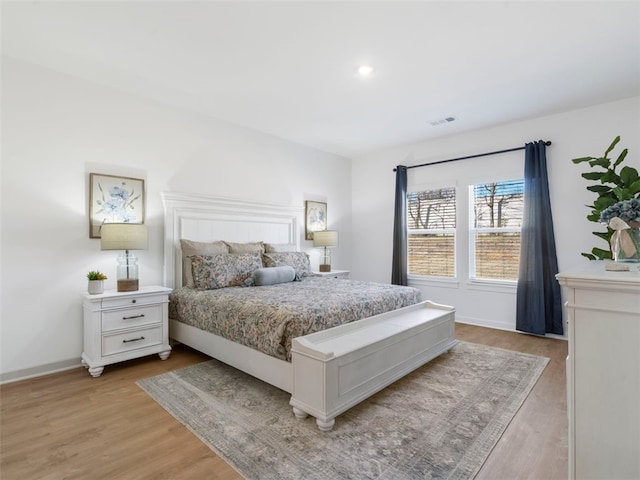 bedroom with light hardwood / wood-style floors