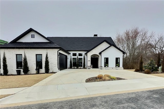 french country home featuring a garage