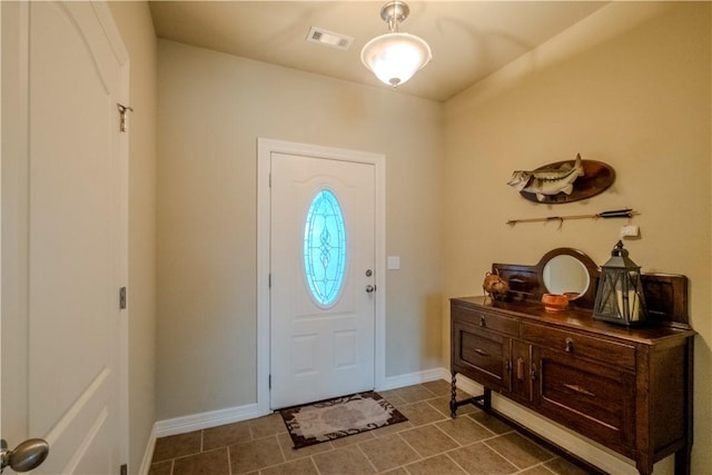 13 Smart Ln, Bella Vista, AR 72715 - foyer entrance with dark tile patterned flooring and baseboards