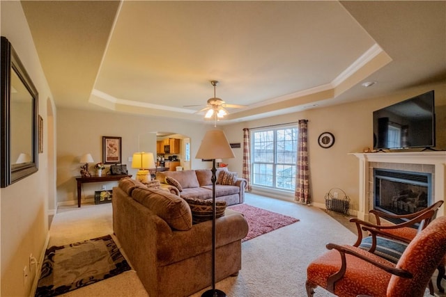 13 Smart Ln, Bella Vista, AR 72715 - living area with a raised ceiling, carpet, arched walkways, and a fireplace
