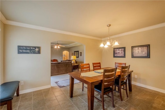 13 Smart Ln, Bella Vista, AR 72715 - dining room with arched walkways, a chandelier, crown molding, baseboards, and a ceiling fan