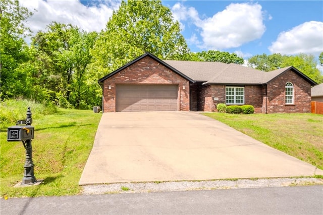 13 Smart Ln, Bella Vista, AR 72715 - single story home with brick siding, an attached garage, concrete driveway, and a front lawn