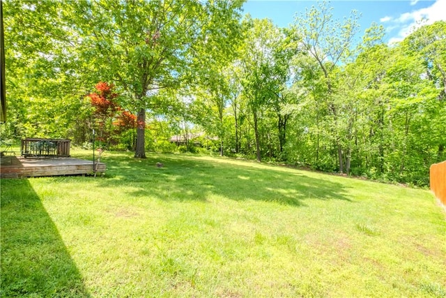 13 Smart Ln, Bella Vista, AR 72715 - view of grassy yard with a wooden deck