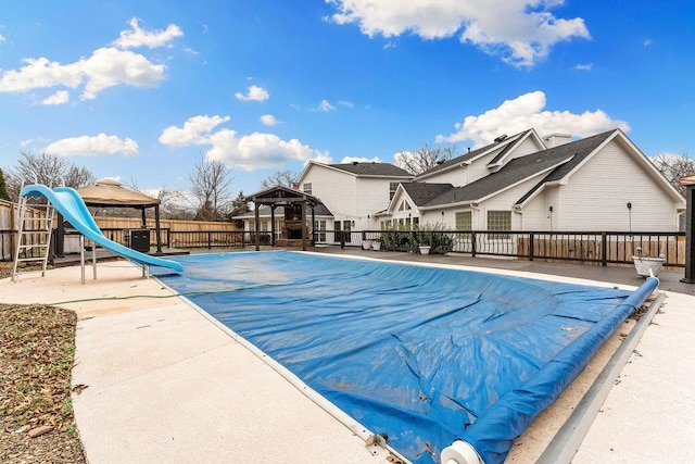 view of pool featuring a gazebo and fence