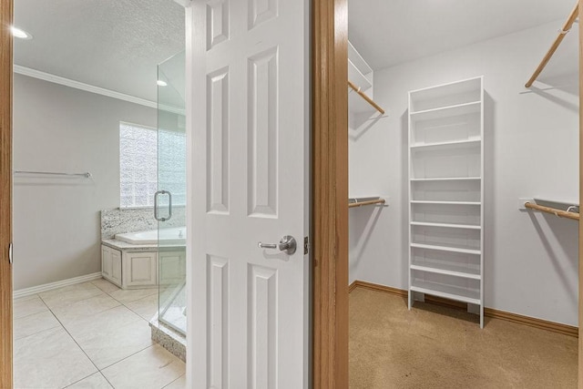 walk in closet featuring light tile patterned floors