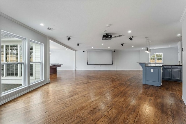 empty room featuring recessed lighting, dark wood finished floors, visible vents, and crown molding