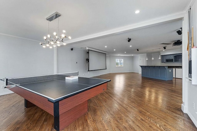 recreation room featuring ornamental molding, recessed lighting, baseboards, and wood finished floors