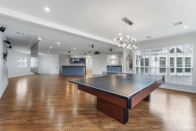 game room featuring recessed lighting, visible vents, a notable chandelier, and wood finished floors