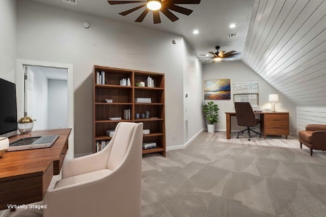 office area with carpet floors, lofted ceiling, visible vents, ceiling fan, and baseboards