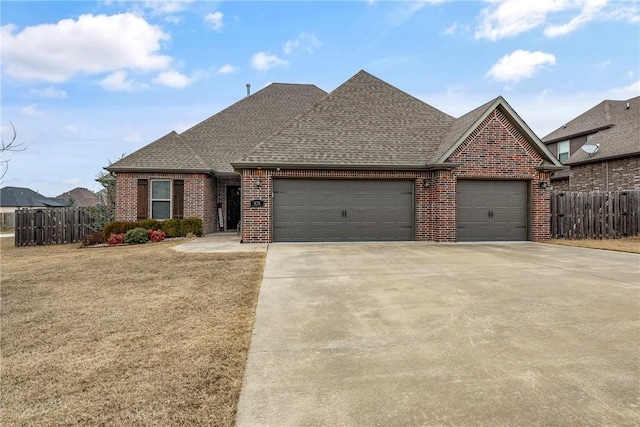 view of front of home with a garage and a front yard