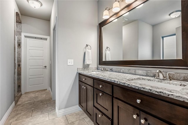 bathroom featuring tile patterned floors and vanity