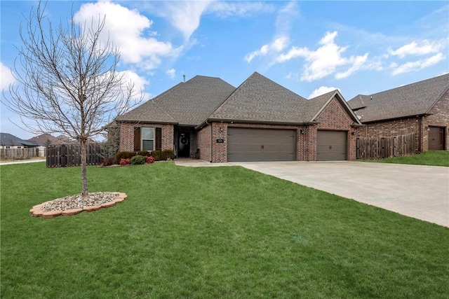 view of front of property with a garage and a front yard