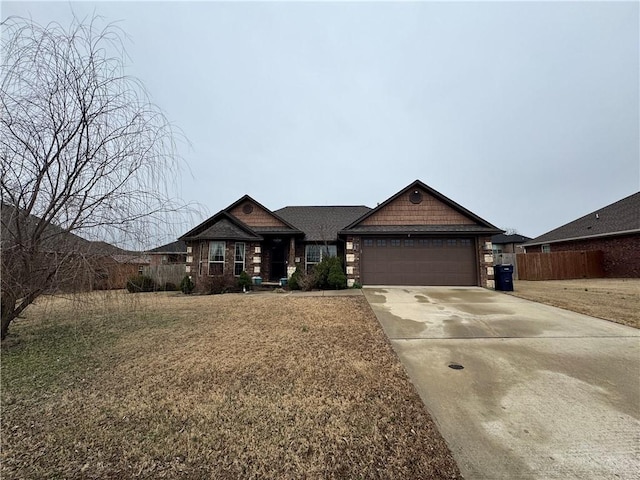 view of front of property with a garage and a front yard