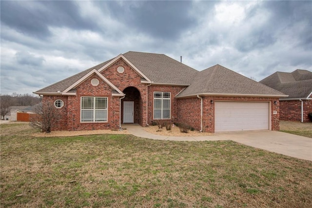 single story home featuring a garage and a front lawn