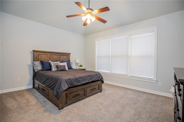 bedroom featuring light carpet and ceiling fan